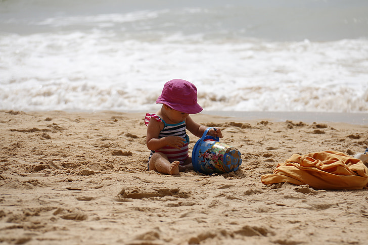 child-playing-beach-bucket-sand-preview.jpg